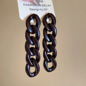 Macro shot of matte dark brown acrylic chunky chain earrings with s925 silver needles