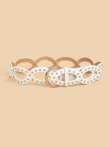 Detail of white PU leather belt featuring silver metal studs and oval hollow-out design