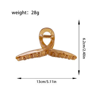 Amber resin shark hair claw clip with dimensions 13cm length and 28g weight