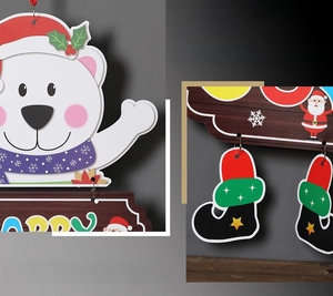 Detail of Christmas polar bear paper ornament with Happy lettering and hanging boots