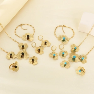 Golden flower jewelry set with necklace and earrings in black and turquoise colors