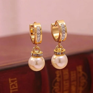 Elegant gold hoop earrings with micro-paved zircons and a large round pearl drop