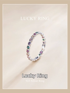 Macro shot of 925 silver ring featuring vibrant colorful zircon stones with fine engraving