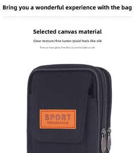 Detail of durable black canvas waist bag with dual zipper compartments and sport logo