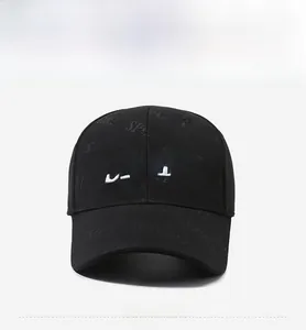 Detail of SPORT letter embroidery and embossed texture on a black baseball cap