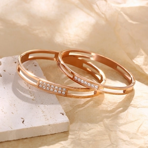 Close-up of rose gold stainless steel bracelets with sparkling zircon inlay details
