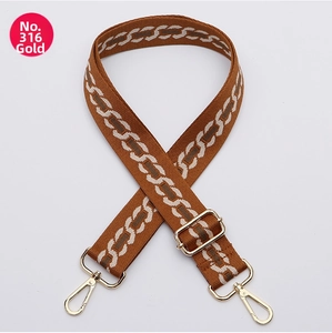 Adjustable wide fabric strap with caramel geometric pattern and gold-tone metal hooks