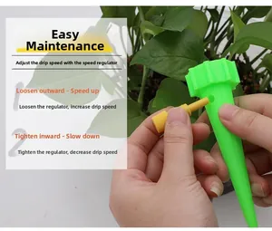 Detail showing hand adjusting the water flow valve on a green automatic drip irrigation spike