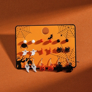 Close-up of a 9-pair Halloween earring set featuring ghosts, pumpkins, and bats on a card