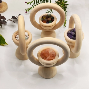 Wooden essential oil diffusers with colorful natural crystals on a white surface