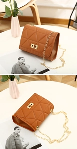 Close-up of caramel quilted leather bag featuring a gold twist lock and chain strap