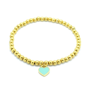 Close-up of 4mm gold beaded bracelet featuring a light blue enamel heart pendant detail