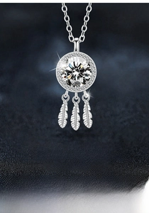 Detail of S925 silver dreamcatcher necklace featuring moissanite and feather pendants