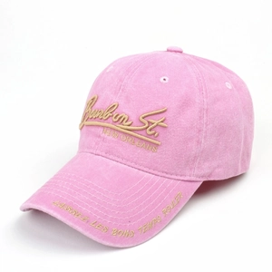 Detailed gold embroidery on pink washed cotton baseball cap with vintage finish