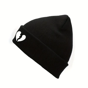 Unisex black knit beanie with white broken heart embroidery in a stylish street style