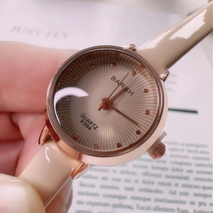 Vintage rectangular quartz watch with rose gold case and beige leather strap