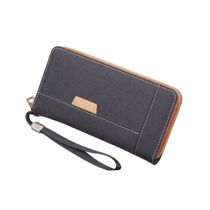 Pochette homme en toile denim gris foncé avec fermeture éclair brune et dragonne