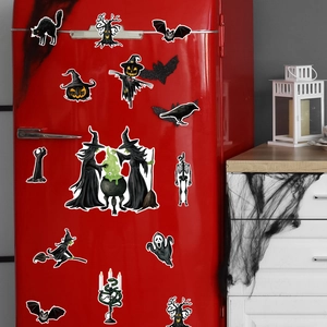Halloween gnome and skull magnetic decals displayed on a vintage red refrigerator door