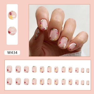 Short square press-on nails featuring cute floral patterns for an elegant spring style