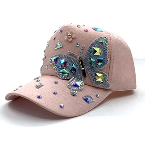 Pink fashion baseball cap featuring a large 3D butterfly made of colorful rhinestones