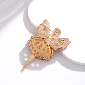 Back view of vintage ballet girl brooch with gold finish and secure safety pin closure