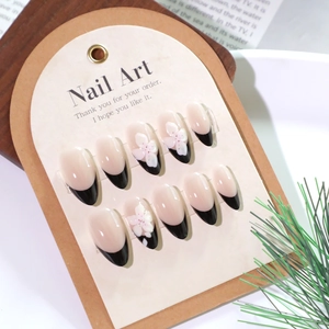 Short black French tip press-on nails with 3D white cherry blossom flower designs