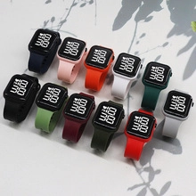 Detailed macro shot of diverse colorful square LED digital watches with nylon elastic straps