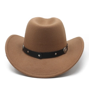 Detailed texture of khaki western cowboy hat with studded leather band and silver ornaments