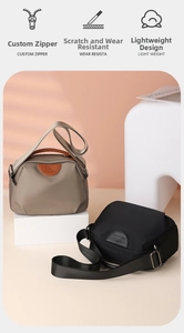 Detail view of water-resistant oxford handbags with premium zippers and durable fabric