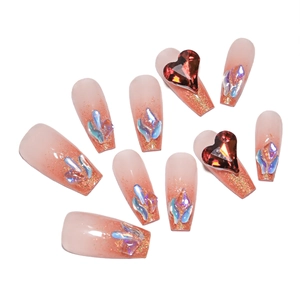 Long coffin press-on nails with gradient glitter and red heart gemstones on white background