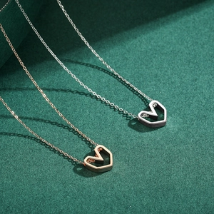Minimalist sterling silver hollow heart pendant necklaces in silver and rose gold finishes