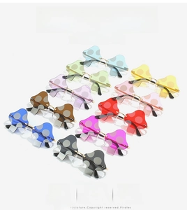Detailed grid of mushroom shaped rimless sunglasses in multiple vibrant colors