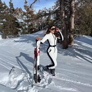 Combinaison de ski une pièce pour femme bicolore blanc et noir en tissu technique