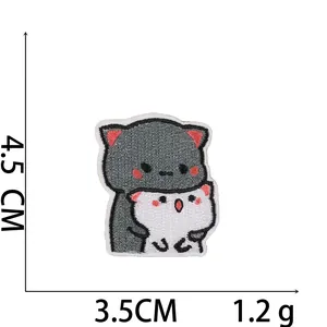 Detailed view of twin cat embroidery patch showing 4.5cm x 3.5cm size and 1.2g weight