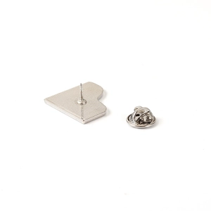 Detail view of the silver metal butterfly clutch and pin backing for music brooches