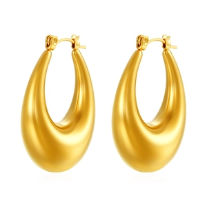 Close-up of polished 18K gold-plated teardrop earrings with a glossy metallic finish