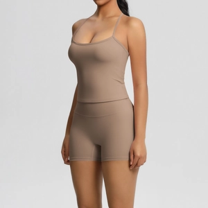 Close-up of mocha brown double-sided brushed fabric on yoga vest and shorts set