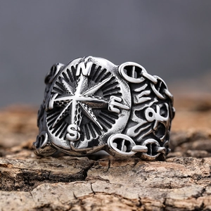 Vintage Nordic compass nautical ring in distressed silver finish on wooden surface