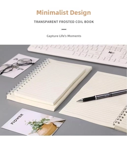 Close-up of A5 notebook with translucent matte cover and double spiral binding detail