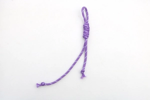 Detail of adjustable purple braided nylon cord with white spots and decorative knots