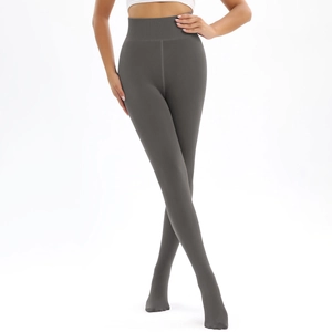 Detailed close-up of high-waisted dark grey thermal leggings with slimming fit effect