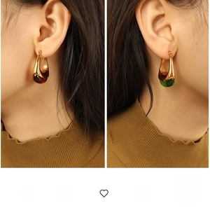 Detailed view of teardrop resin dangles on vintage gold hoop earrings for women