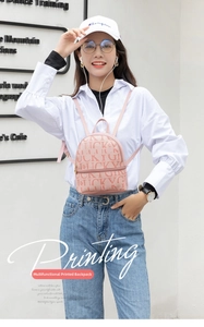 Detail of pink PU leather mini backpack with Lucky letter print and zipper closure