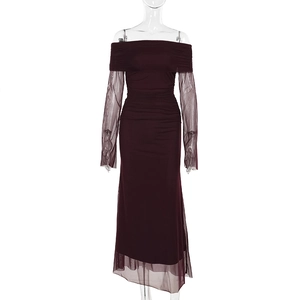 Detailed close-up of dark purple mesh fabric and side pleating on the elegant dress