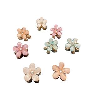 Eight mini flower hair claws with pearlescent finish and rhinestones in Morandi colors