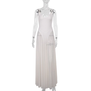 Detail of elegant white mesh dress featuring gold metal chain straps and a translucent hem