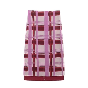 Pink and dark red plaid midi skirt with straight cut and layered hem on white background