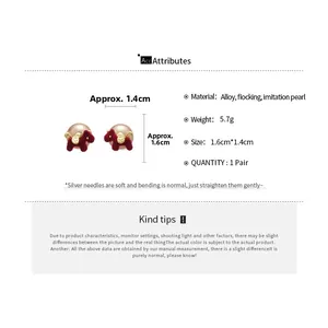 Detail of red flocked puppy earrings with pearls including size and weight specs