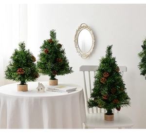 Mini Christmas trees with pine needles and cones on wooden base for tabletop decor