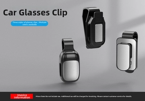 Close-up of car sun visor glasses clips featuring sleek metal plates and black plastic base